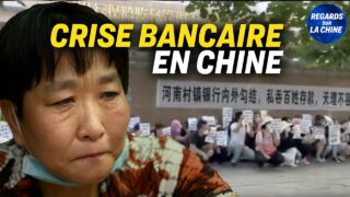 La crise bancaire continue en Chine ; Un prêtre catholique manifeste devant une prison à Hong Kong